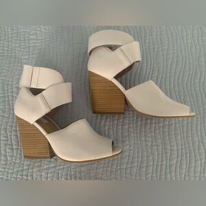 Stylish pair of white Topshop shoes.